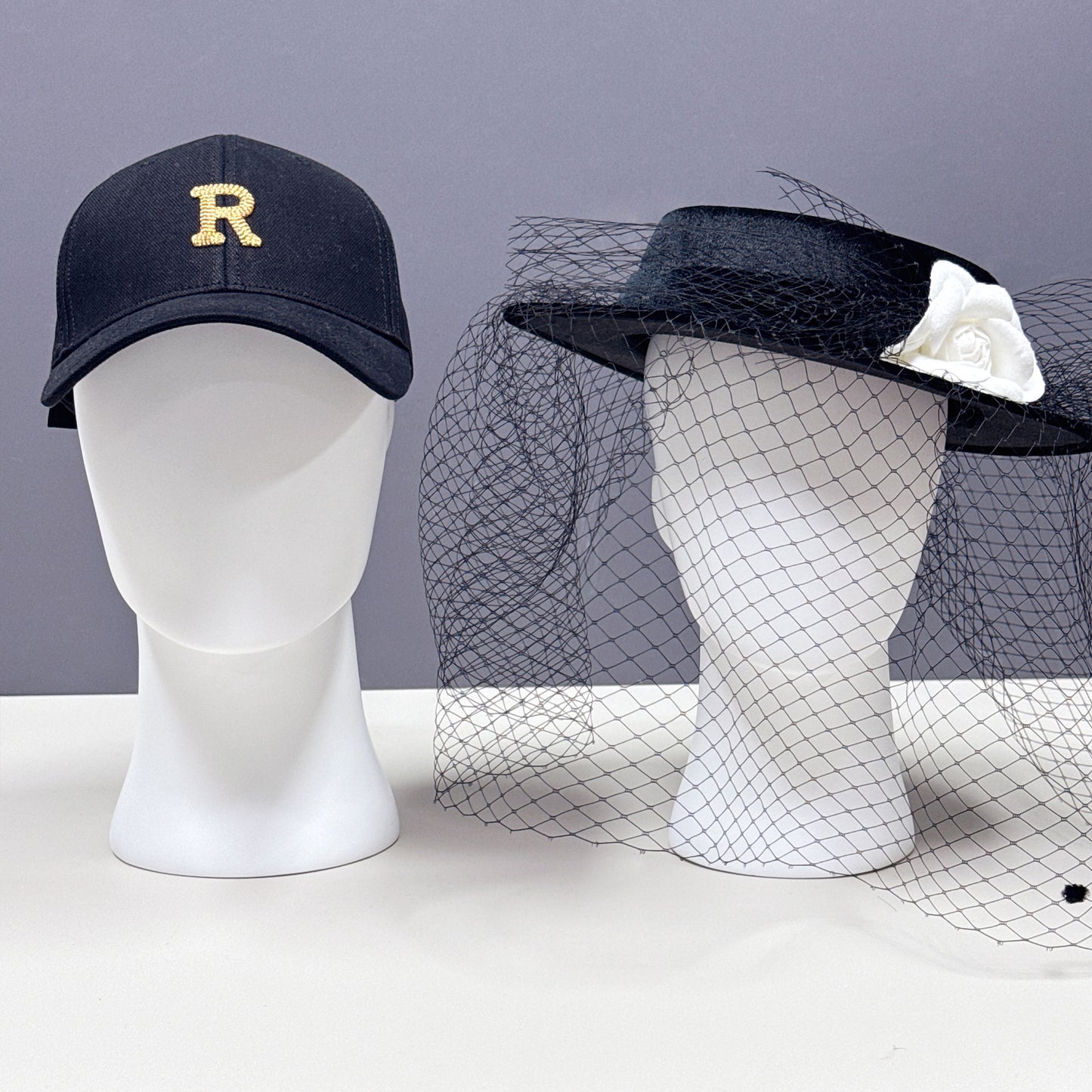 Hat display stand on white mannequin head