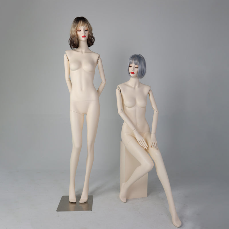 Standing and seated female mannequins with wigs for boutique visual merchandising