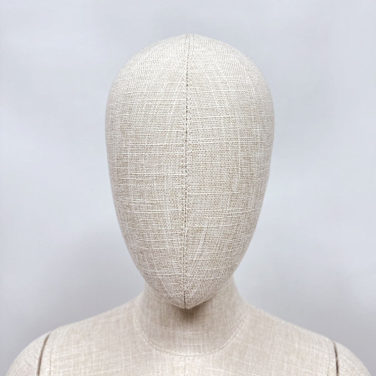 Mannequin head detail showing fabric covering and 360-degree rotation