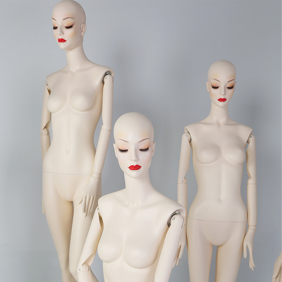 Female mannequins with red lip makeup for boutique and fashion window displays