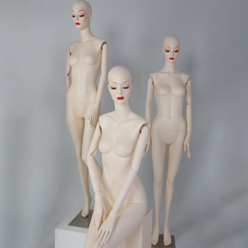 Female seated mannequin combined with standing mannequins for layered fashion window display