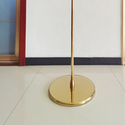 a floor lamp that is on top of a white floor