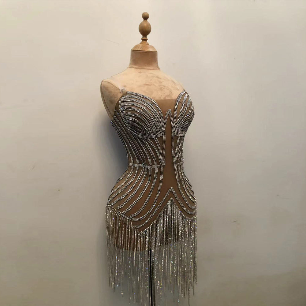 Warm nude beige curvy female velvet torso mannequin displaying a rhinestone fringe dress