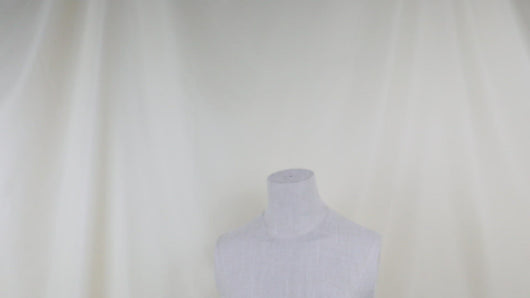 White Clothing Mannequin On A Light Background Near The Curtains