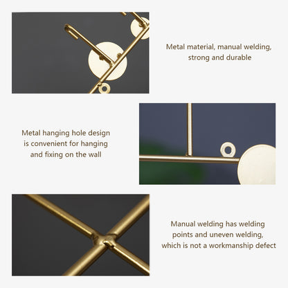 Luxury metal wall hooks in modern gold design for entryway coat and key storage.